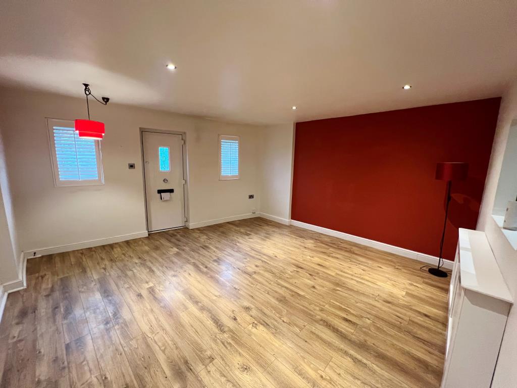 Lot: 79 - GARDEN FLAT IN POPULAR VILLAGE - Living room with wood effect laminate flooring
